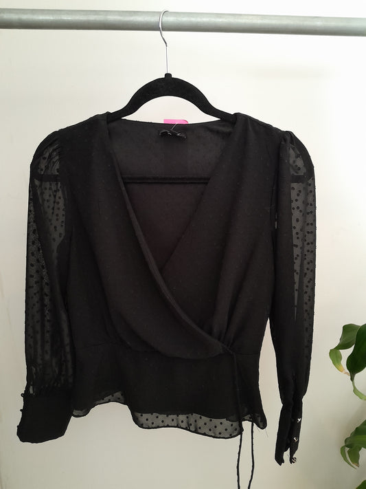 Blusa negra manga transparente