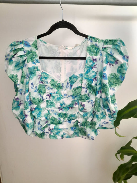 Blusa drapeada flores